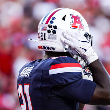Sep 12, 2025; Tucson, Arizona, USA; Arizona Wildcats running back Ismail Mahdi (21) wears the retro helmet for the start of the game against the Kansas State Wildcats at Arizona Stadium. Mandatory Credit: Aryanna Frank-Imagn Images