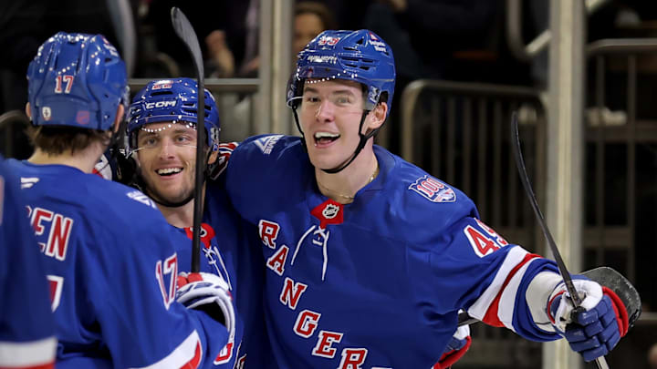 Mar 27, 2026; New York, New York, USA; New York Rangers center Jonny Brodzinski (22) celebrates his goal against the Chicago Blackhawks with right wing Jaroslav Chmelar (49) and defenseman Will Borgen (17) during the second period at Madison Square Garden. 