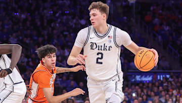 Feb 22, 2025; New York, NY, USA;  Duke Blue Devils guard Cooper Flagg (2) drives past Illinois Fighting Illini forward Will Riley (7) in the first half at Madison Square Garden. Mandatory Credit: Wendell Cruz-Imagn Images