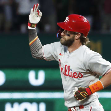 Jul 20, 2024; Pittsburgh, Pennsylvania, USA;  Philadelphia Phillies first baseman Bryce Harper (3) gestures as he runs the bases after hitting a solo home run against the Pittsburgh Pirates during the ninth inning at PNC Park. The Pirates won 4-1.