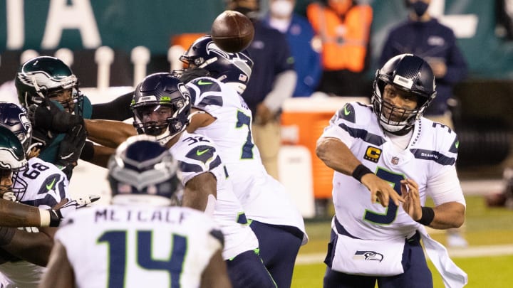Nov 30, 2020; Philadelphia, Pennsylvania, USA; Seattle Seahawks quarterback Russell Wilson (3) passes to wide receiver DK Metcalf (14) against the Philadelphia Eagles during the first quarter at Lincoln Financial Field. Mandatory Credit: Bill Streicher-USA TODAY Sports