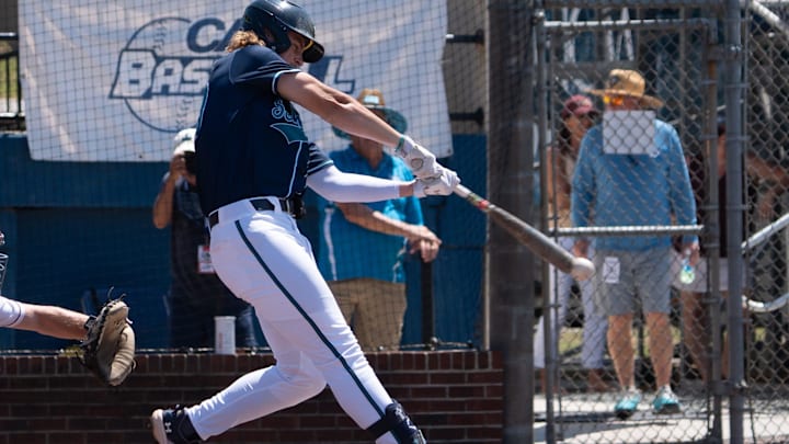 Tanner Thach hits as UNCW faces College of Charleston Saturday in the CAA Baseball Tournament. May 25, 2024.