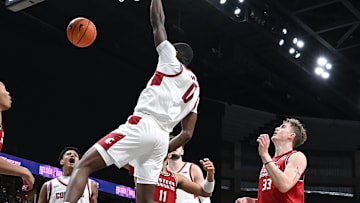 Nov 21, 2024; Spokane, Washington, USA; Washington State Cougars guard Cedric Coward (0) dunks the ball against Eastern Washington Eagles forward Emmett Marquardt (33) in the second half at Spokane Veterans Memorial Arena. Washington State Cougars won 96-81. Mandatory Credit: James Snook-Imagn Images