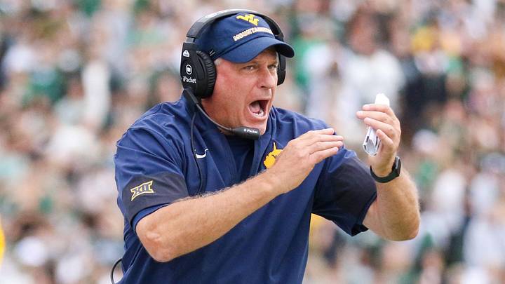 Sep 6, 2025; Athens, Ohio, USA; West Virginia Mountaineers head coach Rich Rodriguez calls a timeout during the second quarter against the Ohio Bobcats at Peden Stadium. Mandatory Credit: Ben Queen-Imagn Images