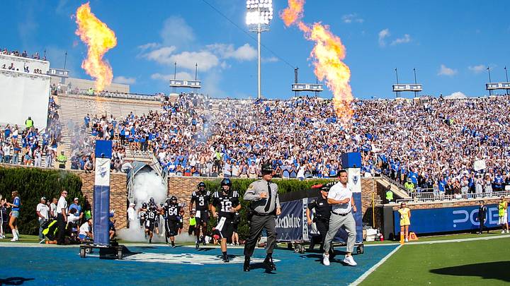 Sep 28, 2024; Durham, North Carolina, USA;  Duke Blue Devils head coach Manny Diaz runs out before the first half of the game against the North Carolina Tar Heels at Wallace Wade Stadium.