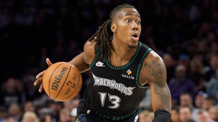 Apr 25, 2026; Minneapolis, Minnesota, USA; Minnesota Timberwolves guard Ayo Dosunmu (13) looks to drive to the basket against the Denver Nuggets in the second quarter at Target Center. Mandatory Credit: Matt Blewett-Imagn Images