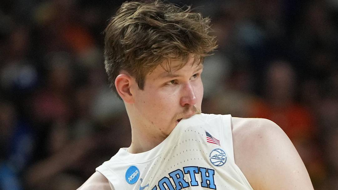 Mar 19, 2026; Greenville, SC, USA; North Carolina Tar Heels center Henri Veesaar (13) bites his jersey against the VCU Rams in the second half of a first round game of the men's 2026 NCAA Tournament at Bon Secours Wellness Arena. Mandatory Credit: Bob Donnan-Imagn Images