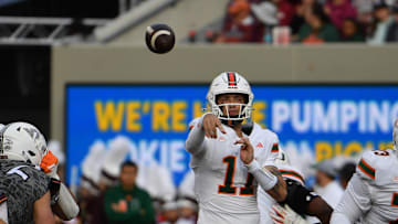 Nov 22, 2025; Blacksburg, Virginia, USA; Miami (FL) Hurricanes quarterback Carson Beck (11) throws a pass against the Virginia Tech Hokies during the second quarter at Lane Stadium. Mandatory Credit: Brian Bishop-Imagn Images