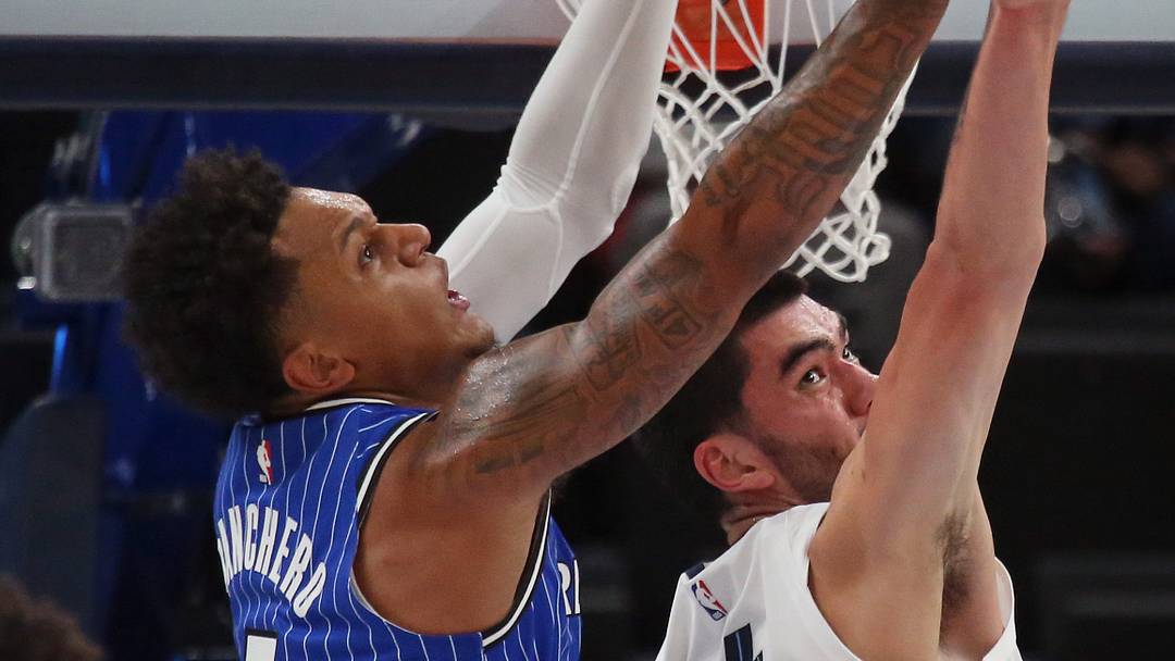 Oct 7, 2026; Memphis, Tennessee, USA;  Orlando Magic forward Paolo Banchero (5) and Memphis Grizzlies center Zach Edey (14) reach for a rebound during the first quarter at FedExForum.  Mandatory Credit: Petre Thomas-Imagn Images