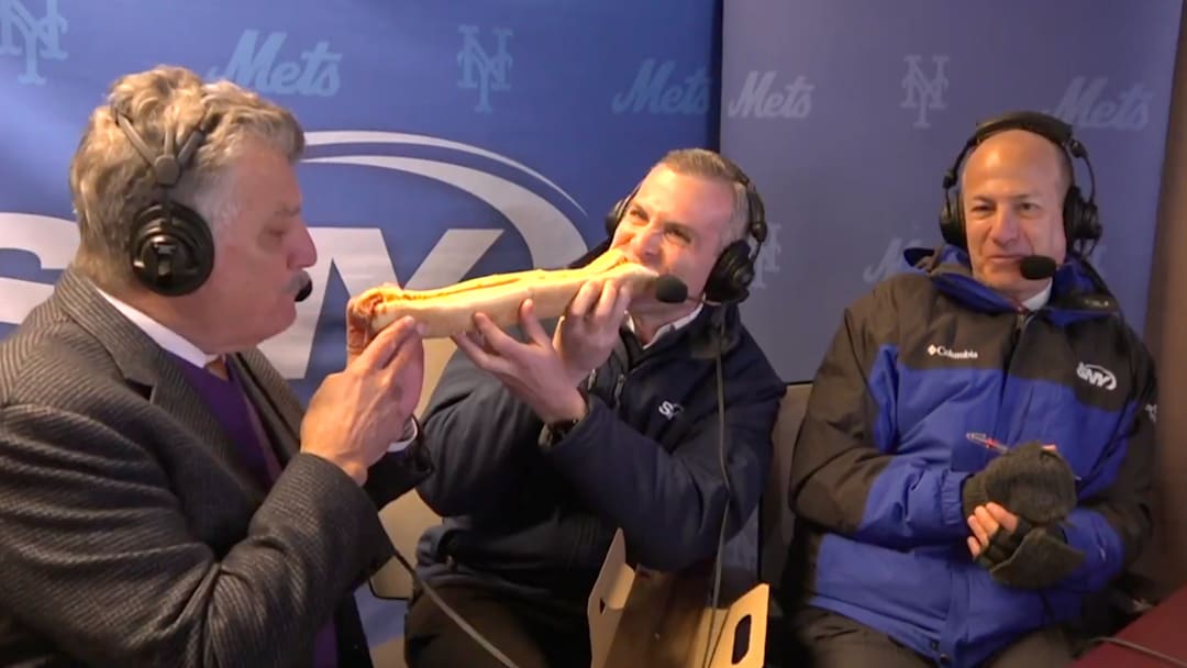 Keith Hernandez and Steve Gelbs dove right into a large, expensive hot dog.