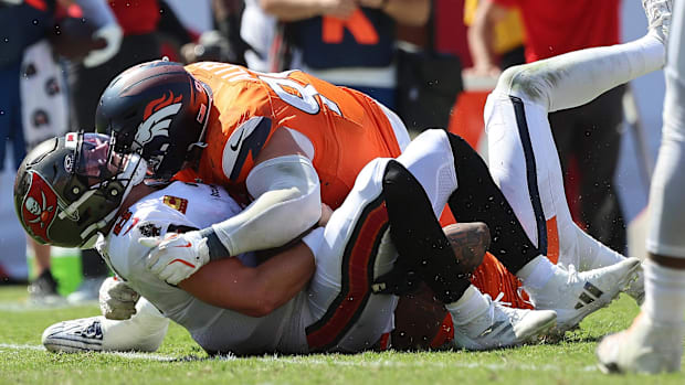 Denver Broncos defensive end Zach Allen (99) sacks Tampa Bay Buccaneers quarterback Baker Mayfield. 