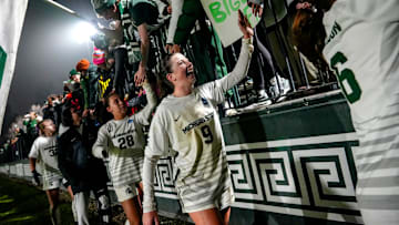 Michigan State's Kayla Briggs, center, and the Spartans celebrate with fans after beating Wake Forest in the second round of the NCAA women's soccer tournament on Thursday, Nov. 20, 2025, at DeMartin Stadium in East Lansing.