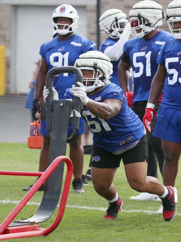 Bills defensive tackle Gable Steveson hits a sled during drills.