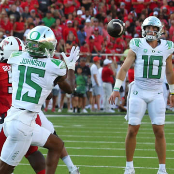 Sep 9, 2023; Lubbock, Texas, USA; Oregon Ducks wide receiver Tez Johnson (15) prepares to make a catch from quarterback Bo Nix (10) against the Texas Tech Red Raiders in the first half at Jones AT&T Stadium and Cody Campbell Field. Mandatory Credit: Michael C. Johnson-USA TODAY Sports