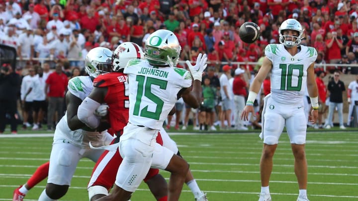 Sep 9, 2023; Lubbock, Texas, USA; Oregon Ducks wide receiver Tez Johnson (15) prepares to make a catch from quarterback Bo Nix (10) against the Texas Tech Red Raiders in the first half at Jones AT&T Stadium and Cody Campbell Field. Mandatory Credit: Michael C. Johnson-USA TODAY Sports