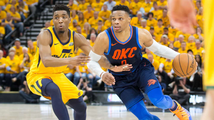 Oklahoma City Thunder guard Russell Westbrook (0) and Utah Jazz guard Donovan Mitchell (45) during the first half of game six of the first round of the 2018 NBA Playoffs at Vivint Smart Home Arena. 