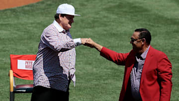 MLB all-time hit leader Pete Rose bumps first with former team mate Tony Perez during a ceremony before the MLB National League game between the Cincinnati Reds and the San Diego Padres at Great American Ball Park in downtown Cincinnati on Saturday, June 25, 2016.