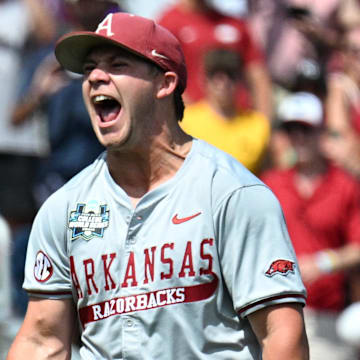 Jun 16, 2025; Omaha, Neb, USA; Arkansas Razorbacks starting pitcher Gage Wood (14) celebrates completing a no hitter against the Murray State Racers at Charles Schwab Field