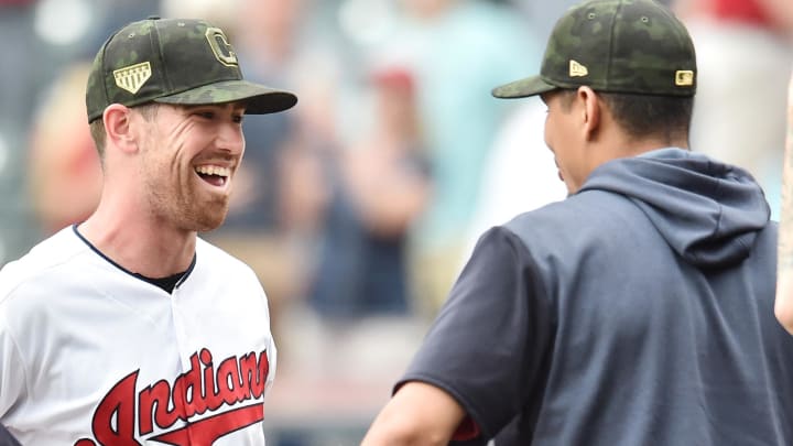 May 19, 2019; Cleveland, OH, USA; Cleveland Indians starting pitcher Shane Bieber (center) celebrates with pitcher Carlos Carrasco (right) after the Indians beat the Baltimore Orioles at Progressive Field. Bieber pitched a complete game shutout with a career high in strikeouts (15). Bieber and Carrasco are free agents after this year. Mandatory Credit: Ken Blaze-USA TODAY Sports