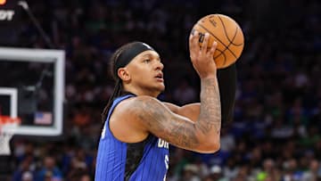 Apr 27, 2025; Orlando, Florida, USA; Orlando Magic forward Paolo Banchero (5) shoots a three point shot against the Boston Celtics in the first quarter during game four of first round for the 2025 NBA Playoffs at Kia Center. Mandatory Credit: Nathan Ray Seebeck-Imagn Images