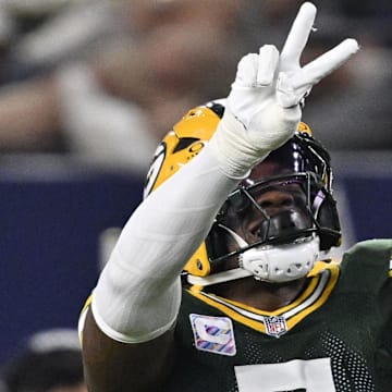 Green Bay Packers linebacker Quay Walker (7) celebrates after making a play against the Cowboys.
