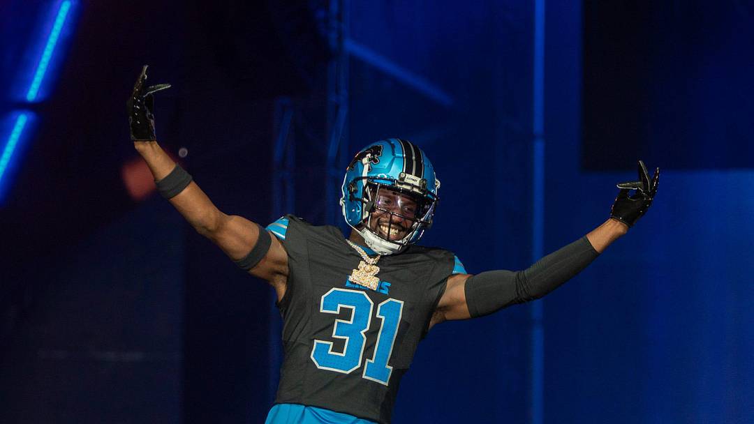 Kerby Joseph (31) walks on stage during the Detroit Lions' new uniform reveal event inside Ford Field in Detroit on Thursday, April 18, 2024.