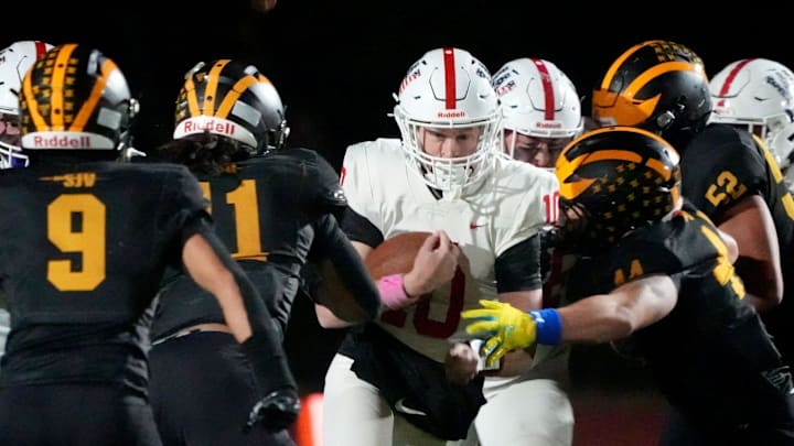 Wall's Brian McKenna (#10) looks for a hole in the St. John Vianney defense during their game in Holmdel Friday night, October 24, 2025. Wall's Brian McKenna (#10) looks for a hole in the St. John Vianney defense during their game in Holmdel Friday night, October 24, 2025.