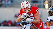 Jacksonville State's Brock Rechsteiner tries to evade the tackle of FIU's Percy Courtney Jr. during college football action at AmFirst Stadium in Jacksonville, Alabama November 16, 2024.