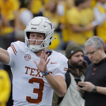 Sep 7, 2024; Ann Arbor, Michigan, USA; Texas Longhorns quarterback Quinn Ewers (3) warms up before the game against the Michigan Wolverines at Michigan Stadium. Mandatory Credit: Rick Osentoski-Imagn Images