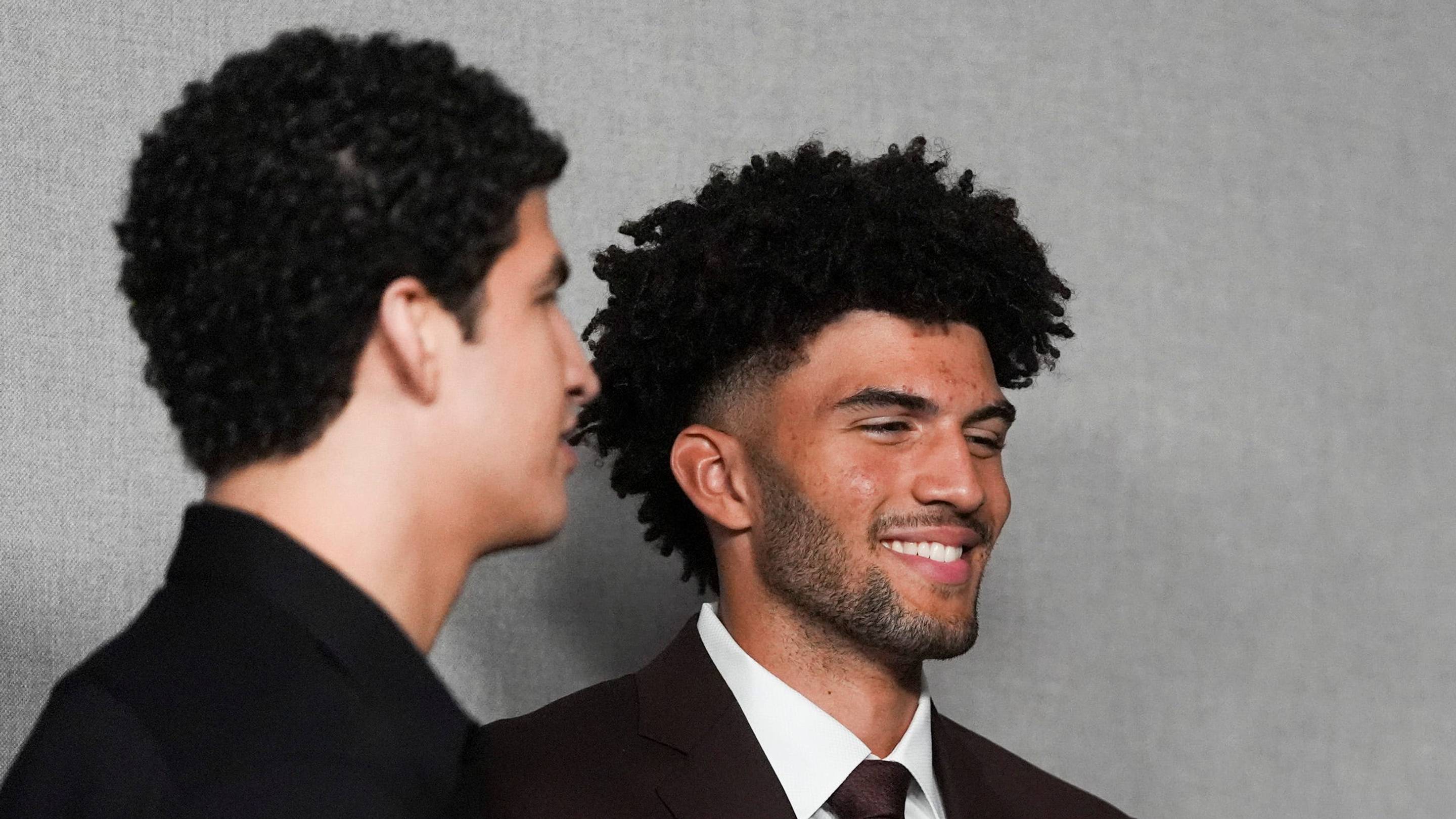 Grizzlies 2026 NBA Draft picks Karim Lopez, Cam Boozer and Richie Saunders laugh with each other after their introductory press conference at FedExForum in Memphis, Tenn., on June 25, 2026.
