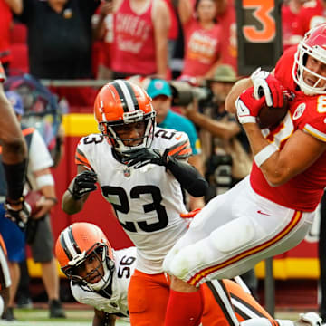Sep 12, 2021; Kansas City, Missouri, USA; Kansas City Chiefs tight end Travis Kelce (87) scores a touchdown against Cleveland Browns strong safety John Johnson (43) and cornerback Troy Hill (23) and outside linebacker Malcolm Smith (56) during the second half at GEHA Field at Arrowhead Stadium. Mandatory Credit: Jay Biggerstaff-Imagn Images