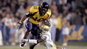 Nov 4, 2006; Berkeley, CA, USA; California Bears tailback (10) Marshawn Lynch is tackled by UCLA Bruins (3) Rodney Van during the first quarter of play against the UCLA Bruins at Memorial Stadium in Berkeley, CA. Mandatory Credit: Phil Carter-Imagn Images

