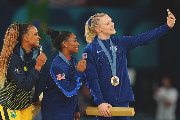 Brazil’s Rebeca Andrade (left) took home the silver while the U.S.'s Jade Carey finished with a redemptive bronze medal.