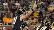 Aug 31, 2023; Columbia, Missouri, USA; Missouri Tigers quarterback Sam Horn (21) throws a pass against the South Dakota Coyotes during the second half at Faurot Field at Memorial Stadium. Mandatory Credit: Denny Medley-Imagn Images