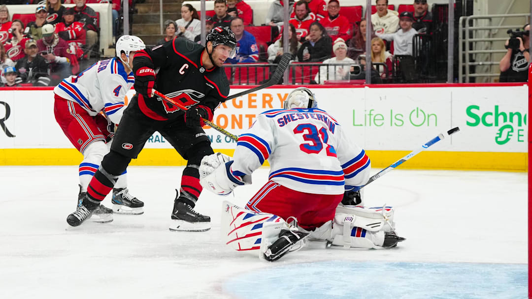 Apr 12, 2025; Raleigh, North Carolina, USA;  aCarolina Hurricanes center Jordan Staal (11) scores a goal past New York Rangers goaltender Igor Shesterkin (31) during the third period t Lenovo Center. Mandatory Credit: James Guillory-Imagn Images