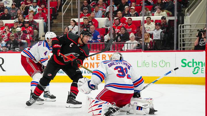 Apr 12, 2025; Raleigh, North Carolina, USA;  aCarolina Hurricanes center Jordan Staal (11) scores a goal past New York Rangers goaltender Igor Shesterkin (31) during the third period t Lenovo Center. Mandatory Credit: James Guillory-Imagn Images