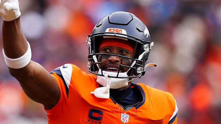 Jan 25, 2026; Denver, CO, USA; Denver Broncos wide receiver Courtland Sutton (14) reacts after catching a touchdown pass against the New England Patriots during the first half in the 2026 AFC Championship Game at Empower Field at Mile High. Mandatory Credit: Ron Chenoy-Imagn Images