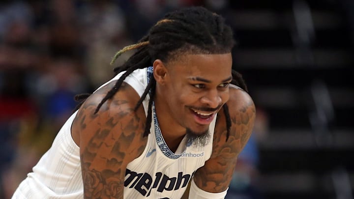Dec 26, 2025; Memphis, Tennessee, USA; Memphis Grizzlies guard Ja Morant (12) reacts during the second quarter against the Milwaukee Bucks at FedExForum. Mandatory Credit: Petre Thomas-Imagn Images