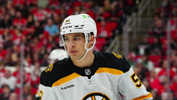Oct 31, 2024; Raleigh, North Carolina, USA;  Boston Bruins center Matthew Poitras (51) looks on against the Carolina Hurricanes during the first period at Lenovo Center. Mandatory Credit: James Guillory-Imagn Images
