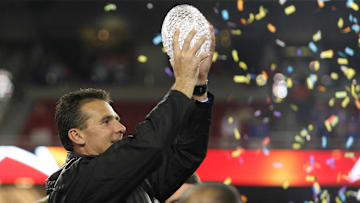 Jan 8, 2007; Glendale, AZ, USA; Florida Gators head coach Urban Meyer with the trophy after the BCS National Championship game at the University of Phoenix Stadium. The Florida Gators won 41-14 over the Ohio State Buckeyes. Mandatory Credit: Matthew Emmons-Imagn Images