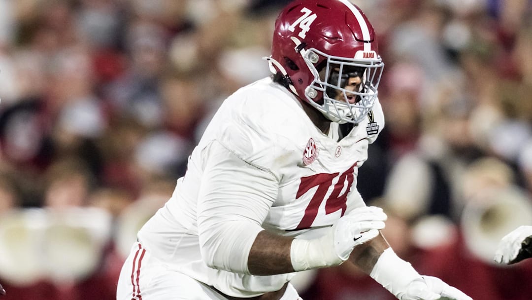 Alabama tackle Kadyn Proctor looks to block against the Oklahoma Sooners in the national playoffs.