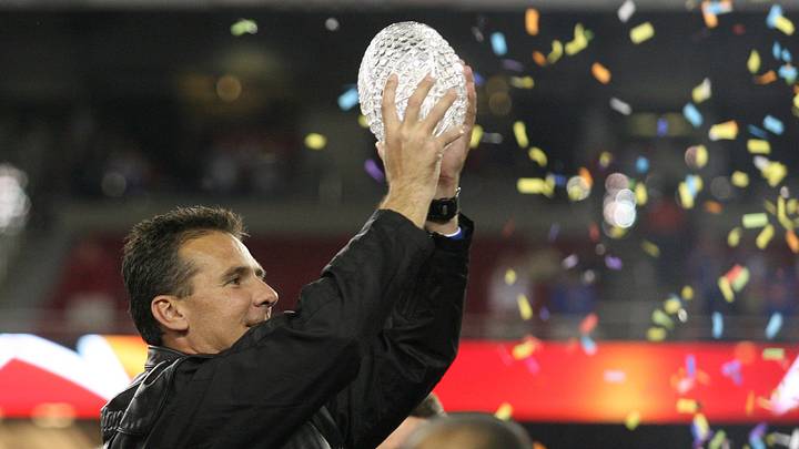 Jan 8, 2007; Glendale, AZ, USA; Florida Gators head coach Urban Meyer with the trophy after the BCS National Championship game at the University of Phoenix Stadium. The Florida Gators won 41-14 over the Ohio State Buckeyes. Mandatory Credit: Matthew Emmons-USA TODAY Sports