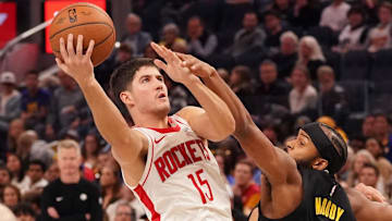 Nov 26, 2025; San Francisco, California, USA;  Houston Rockets guard Reed Sheppard (15) drives to the basket while guarded by Golden State Warriors guard Moses Moody (4) in the fourth quarter at Chase Center. Mandatory Credit: David Gonzales-Imagn Images
