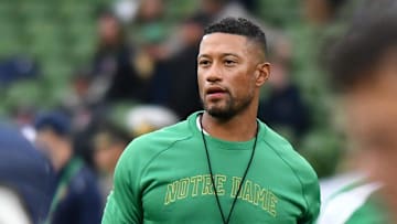 Aug 26, 2023; Dublin, [ENTER STATE], IRL; Notre Dame Fighting Irish head coach Marcus Freeman watches warmups before the game against Navy at Aviva Stadium. 