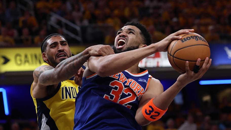 New York Knicks center Karl-Anthony Towns drives to the hoop past Indiana Pacers forward Obi Toppin. | Trevor Ruszkowski-Imagn Images
