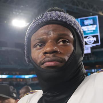 Baltimore Ravens quarterback Lamar Jackson walks off the field after a win over Miami Dolphins.