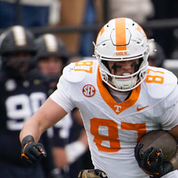 Tennessee tight end Miles Kitselman (87) is stopped by Vanderbilt cornerback Kolbey Taylor (6) during the second quarter at FirstBank Stadium in Nashville, Tenn., Saturday, Nov. 30, 2024.