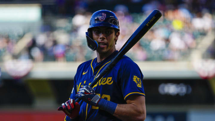 Jul 4, 2024; Denver, Colorado, USA; Milwaukee Brewers left fielder Christian Yelich (22) wears 4th of July colors against the Colorado Rockies during the first inning at Coors Field. Mandatory Credit: Troy Babbitt-USA TODAY Sports

 