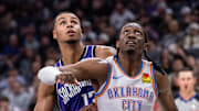 Nov 25, 2024; Sacramento, California, USA; Oklahoma City Thunder forward Jalen Williams (8) and Sacramento Kings forward Keegan Murray (13) fight for position under the basket during the second quarter at Golden 1 Center. Mandatory Credit: Ed Szczepanski-Imagn Images