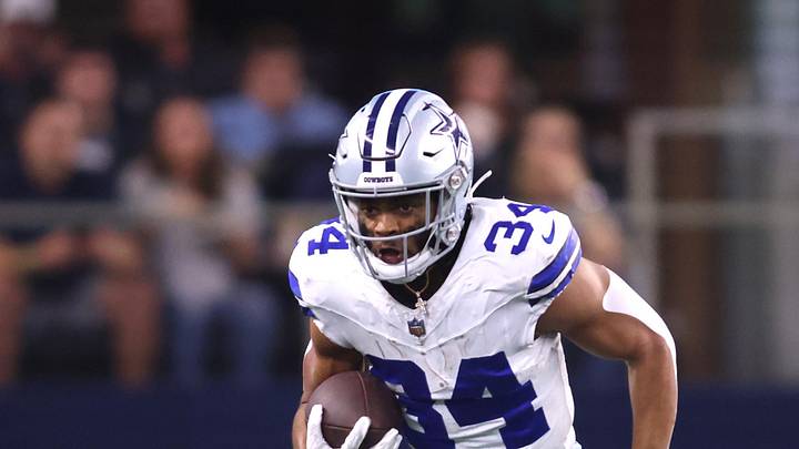 Aug 26, 2023; Arlington, Texas, USA; Dallas Cowboys running back Malik Davis (34) runs the ball against Las Vegas Raiders cornerback Duke Shelley (23) in the second quarter at AT&T Stadium. Mandatory Credit: Tim Heitman-Imagn Images
